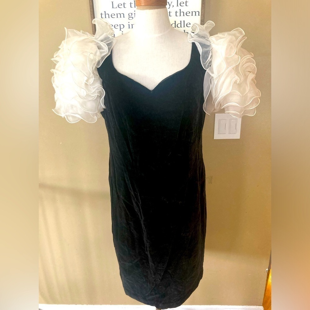 Black Antique dress fits like women’s Large velvet black with poof white sleeves